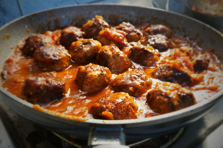Juicy Italian Meatballs in a rich homemade tomato sauce, perfect for pasta, mashed potatoes, or crusty bread.