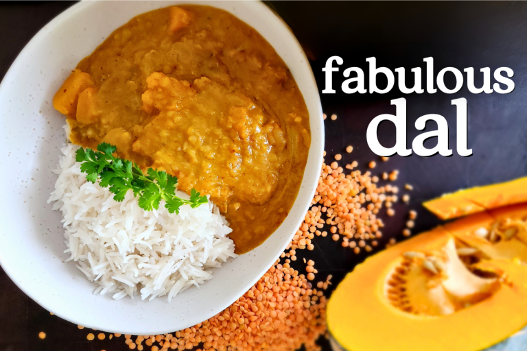 A bowl of red lentil dal with roasted pumpkin, served with rice and a side of mango chutney—warm, vibrant, and comforting.