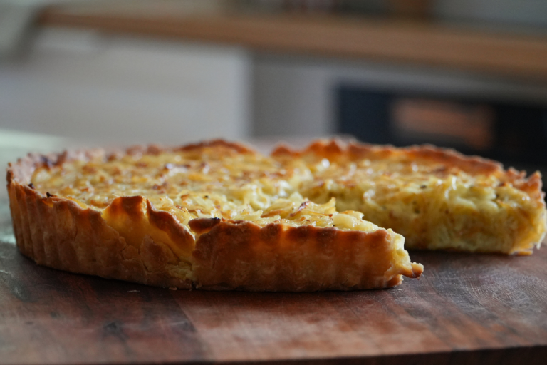 French onion tart from Alsace with thin golden pastry and creamy onion filling