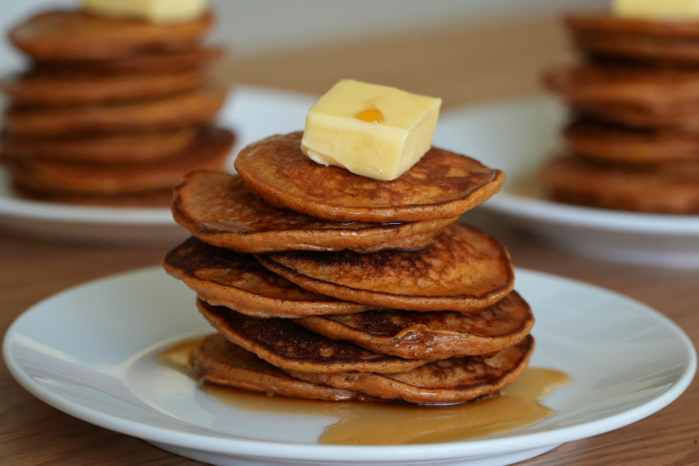Sweet potato silver dollars stacked on plates, perfect for lunch boxes or snacks