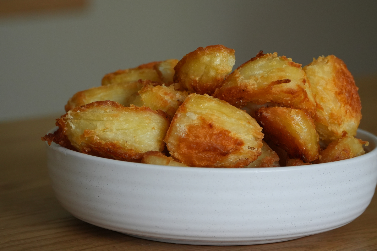 Bowl of crispy roast potatoes made using a simple fork method