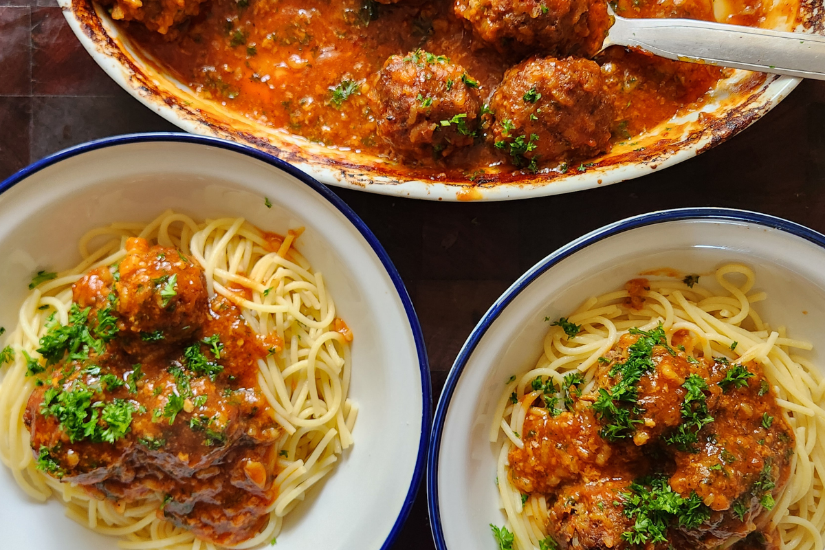 Porcupine meatballs with rice in tomato sauce served with spaghetti