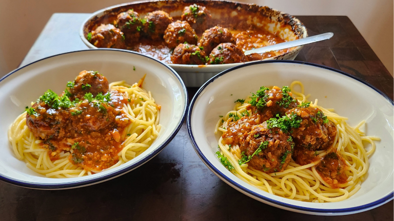 Porcupine meatballs in tomato sauce served with spaghetti