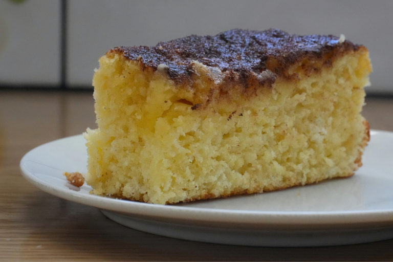 Slice of French scone showing the soft tender crumb and cinnamon sugar topping